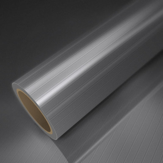 Rollo de vinilo aluminio cepillado sobre una lámina del mismo vinilo
