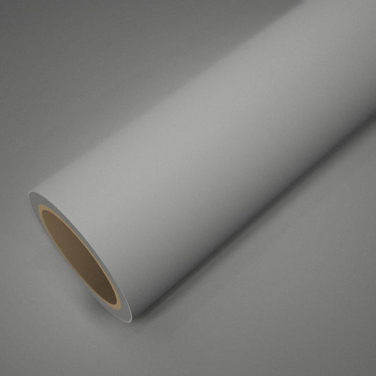 Rollo de vinilo blanco mate sobre una lámina del mismo vinilo