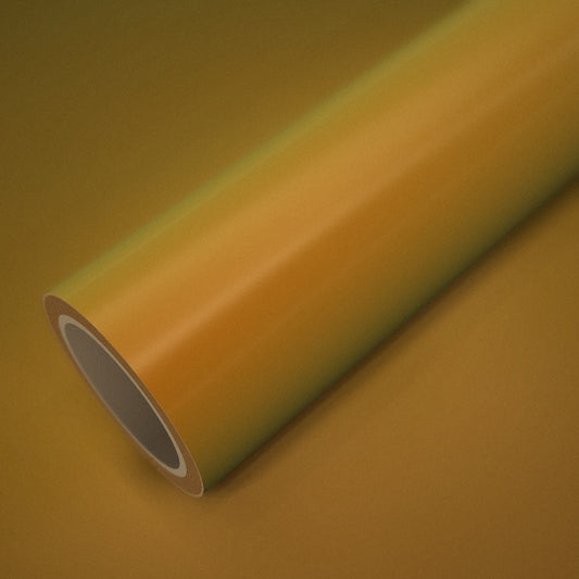 Rollo de vinilo naranja dorado mágico sobre una lámina del mismo vinilo